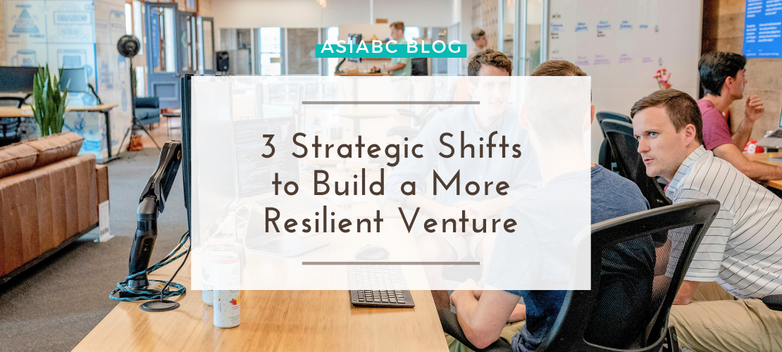Entrepreneurs in a modern co-working space exploring AsiaBC’s startup insights for building a resilient & scalable venture.