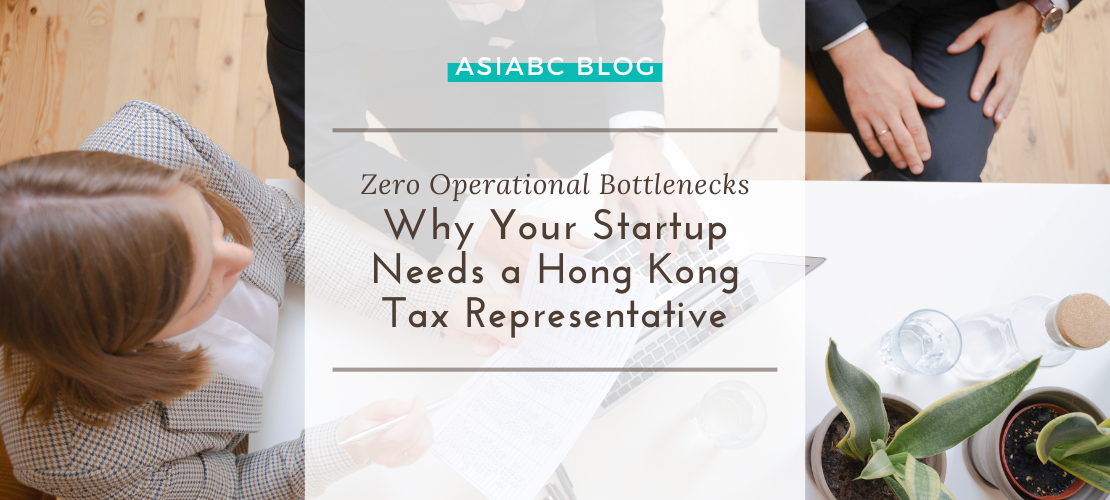 Startup team & tax advisor collaborating over paperwork at a minimalist desk to streamline corporate tax compliance services.